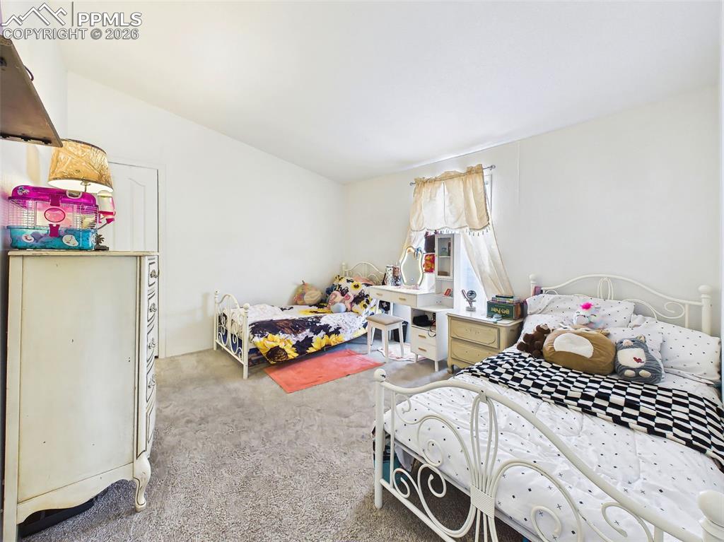 Image 29 of 50: Bedroom – Versatile bedroom space with ample floor area and closet storage,
