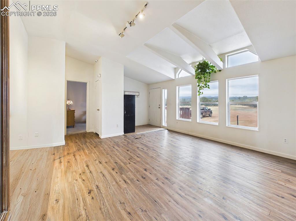 Image 3 of 50: Living Room – Main Area – Bright and open living space featuring vaulted ce