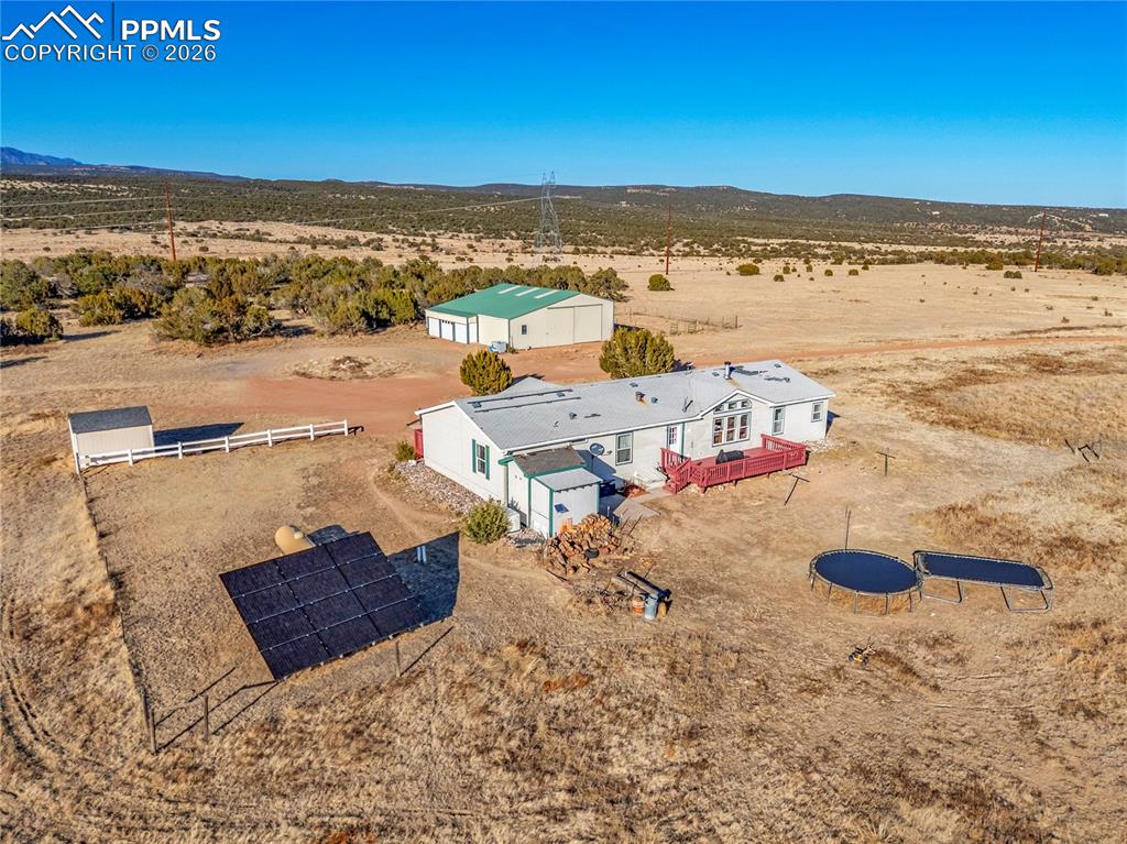 Image 34 of 50: Aerial View – Acreage & Ponderosa Pines – Wide aerial highlighting the grou