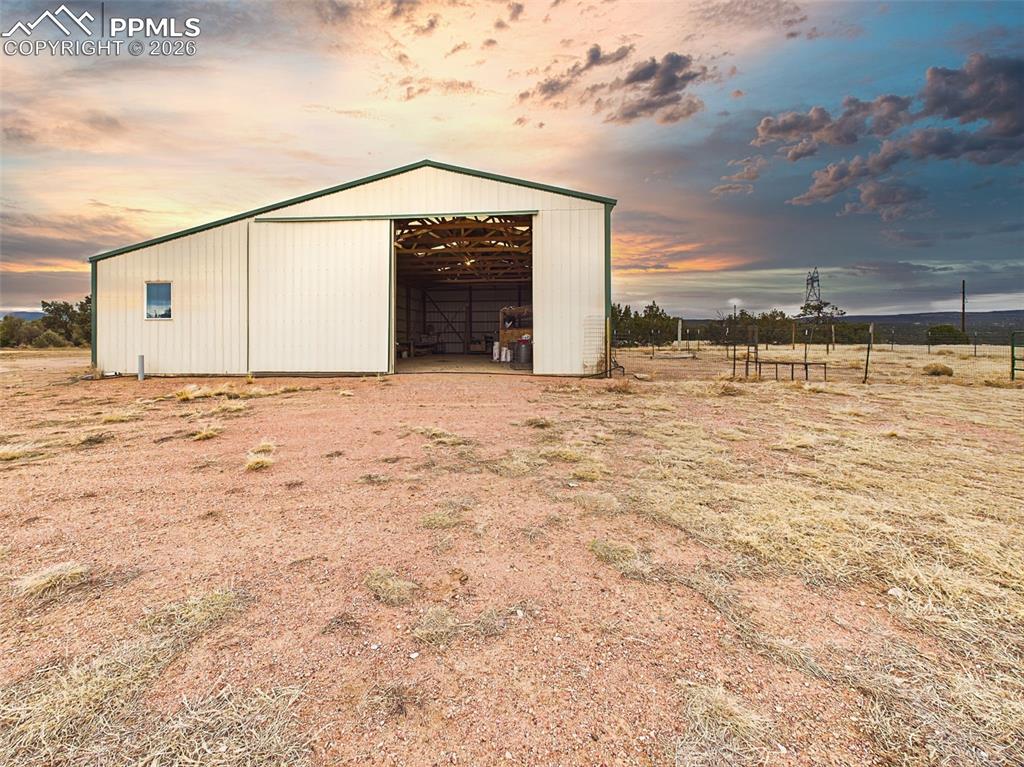 Image 37 of 50: Pole Barn – Front Access – Large sliding door allows for easy entry of vehi