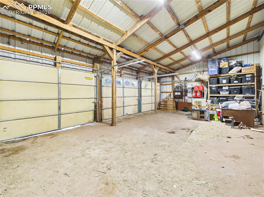 Image 41 of 50: Garage Interior – Multi-Bay Space – Interior of the pole barn features high