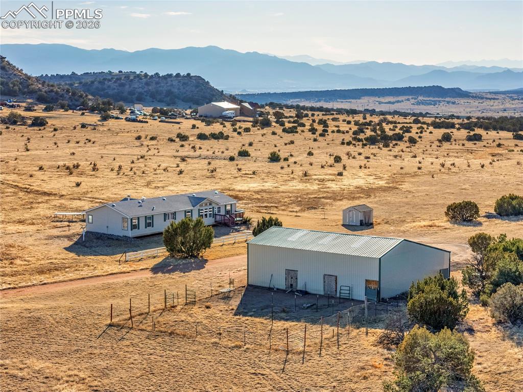 Image 44 of 50: Aerial View – Home & Outbuilding Layout – Bird’s-eye perspective clearly il