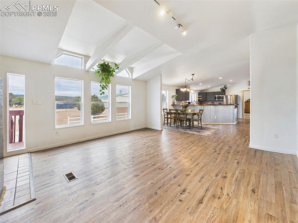 Image 5 of 50: Living Room – Alternate View – Open-concept layout seamlessly connects the 