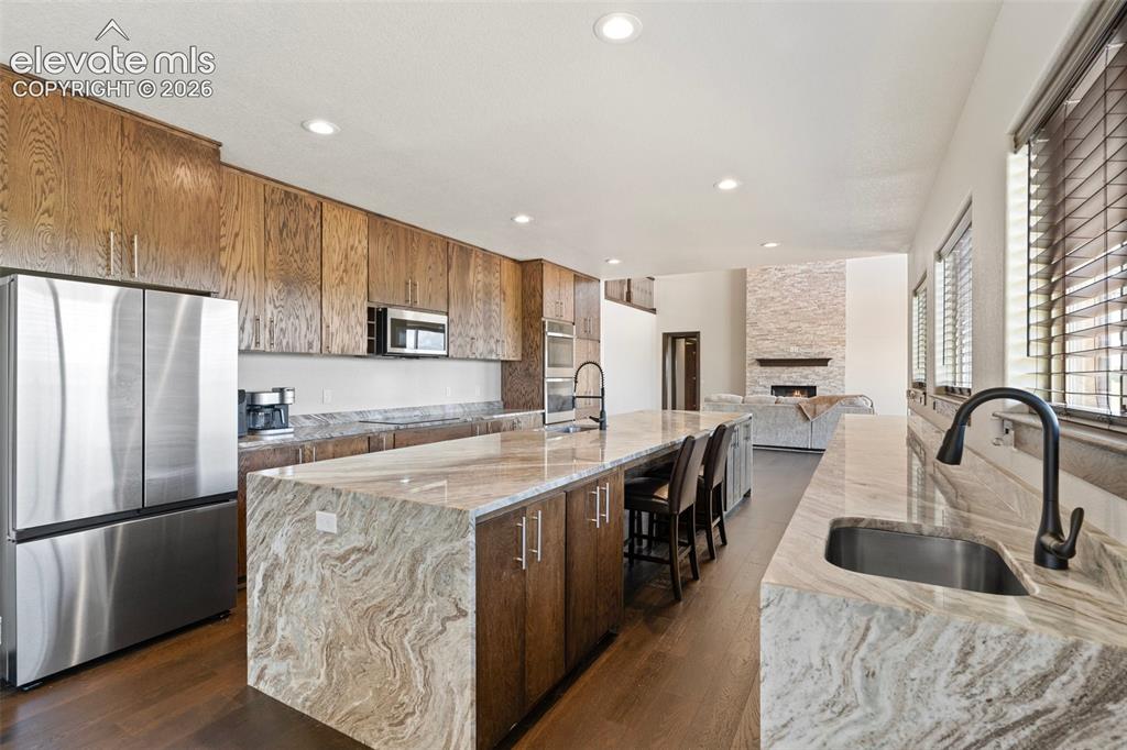 Image 12 of 46: Gourmet kitchen with extensive counter space, including an oversized island
