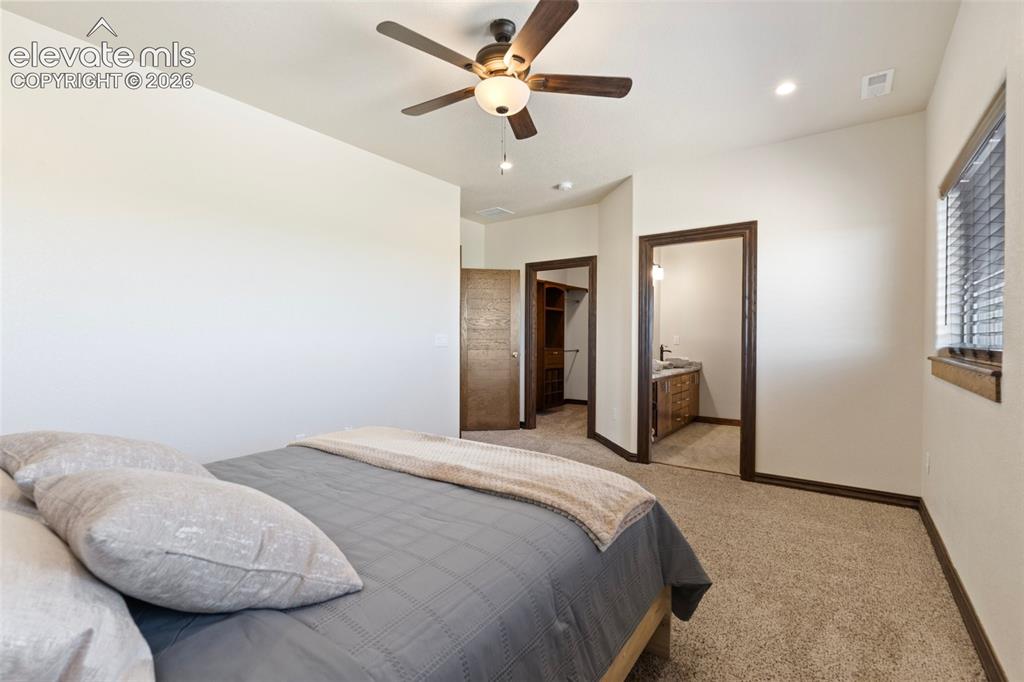 Image 36 of 46: Carpeted room featuring a ceiling fan with integrated lighting, recessed li