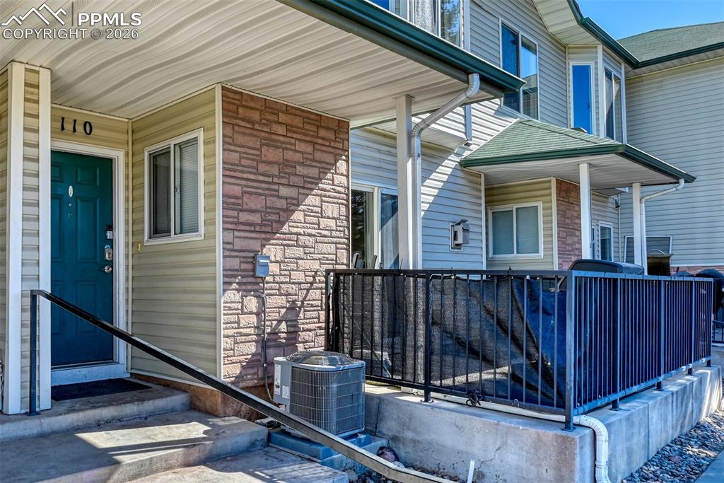 Image 1 of 35: Entrance to property featuring stone siding and a porch