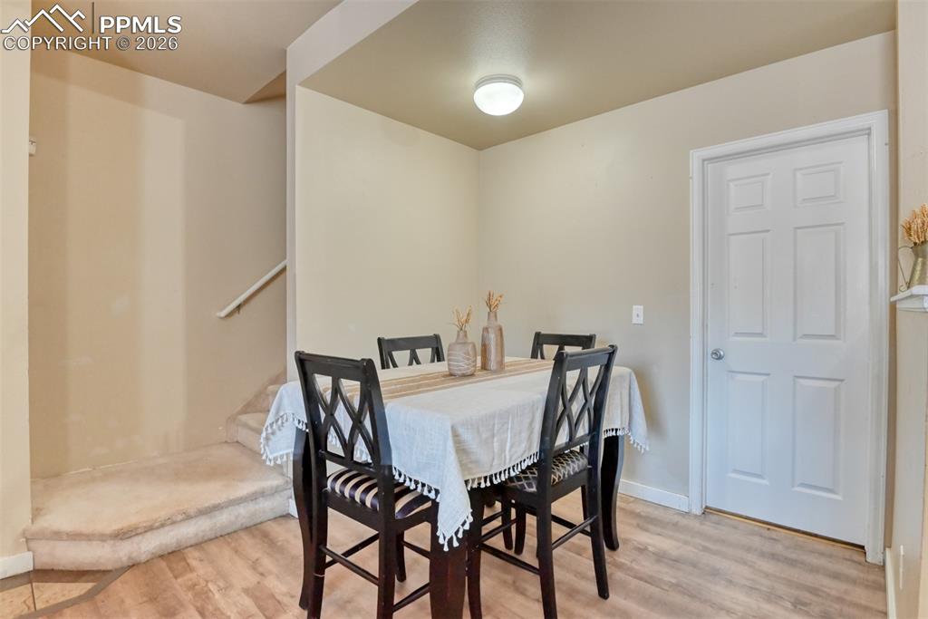 Image 13 of 35: Dining room featuring light wood-type flooring and baseboards