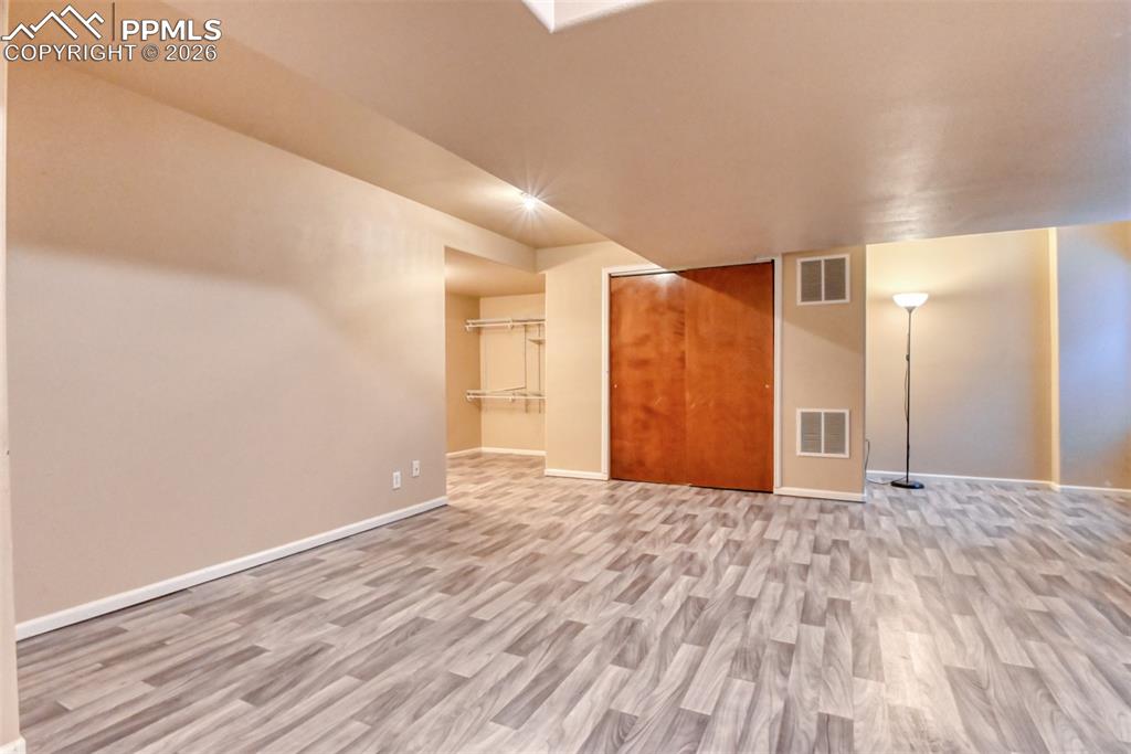 Image 19 of 35: Bonus room featuring light wood-style flooring and baseboards
