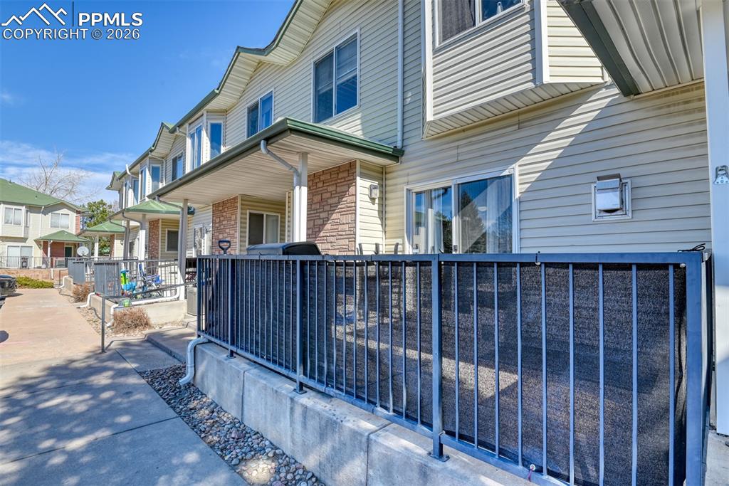 Image 2 of 35: View of side of property with brick siding