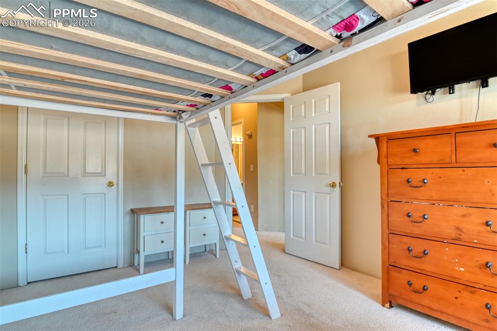 Image 32 of 35: Unfurnished bedroom featuring light colored carpet