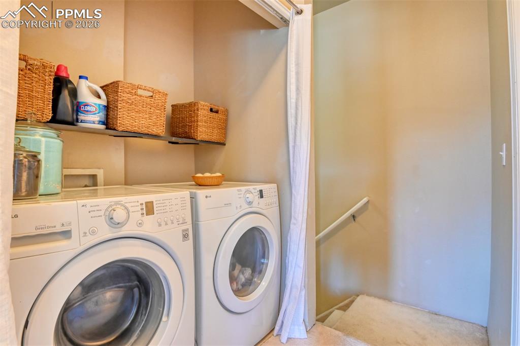 Image 33 of 35: Laundry area featuring independent washer and dryer