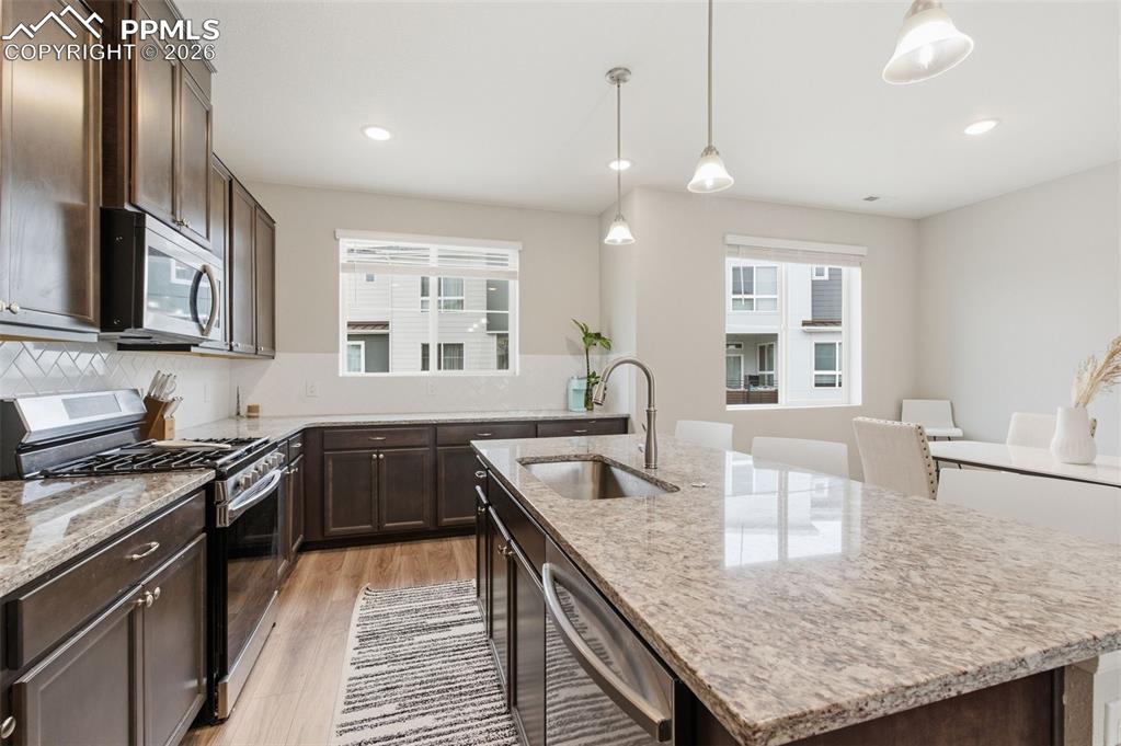 Image 10 of 38: All stainless appliances are included with gas range and washer dryer conve