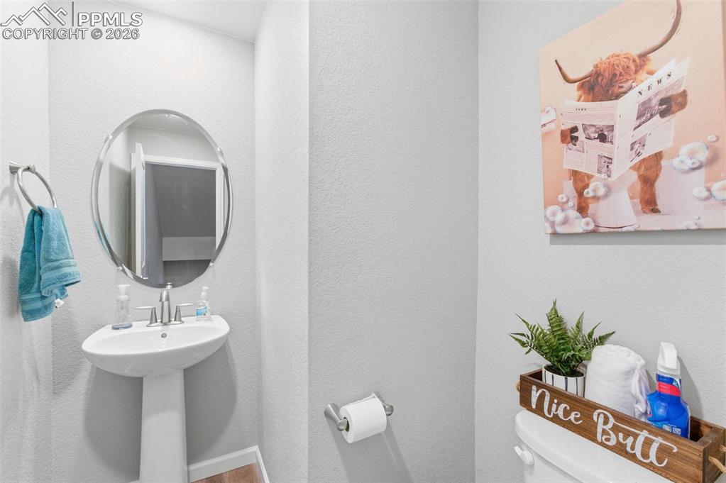 Image 13 of 38: Main level bathroom