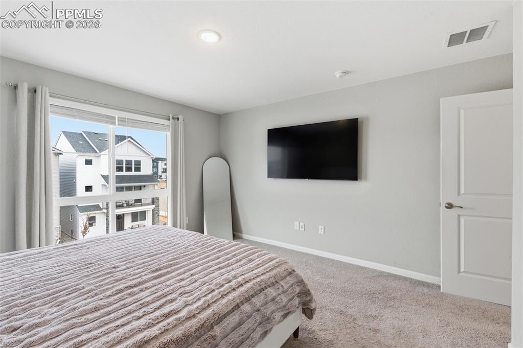 Image 17 of 38: Nice view of area from primary bedroom