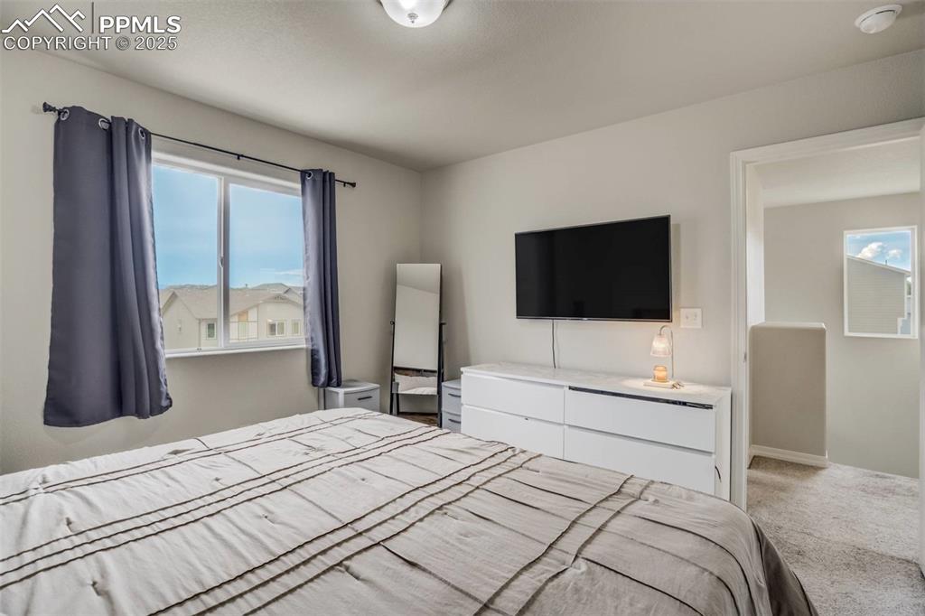 Image 15 of 27: Bedroom with carpet