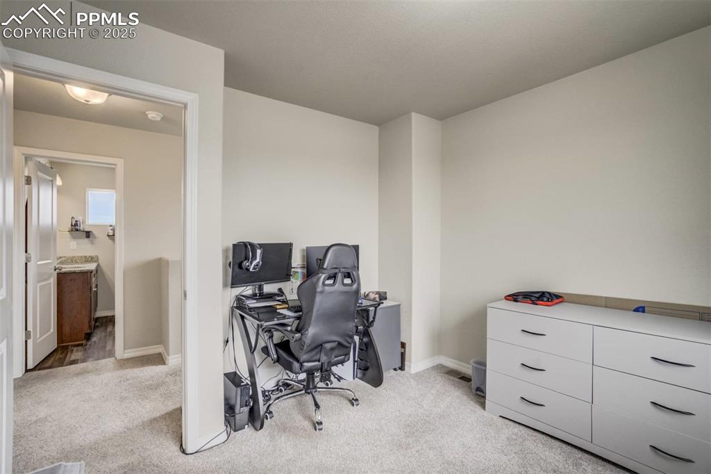 Image 20 of 27: Office area with light carpet