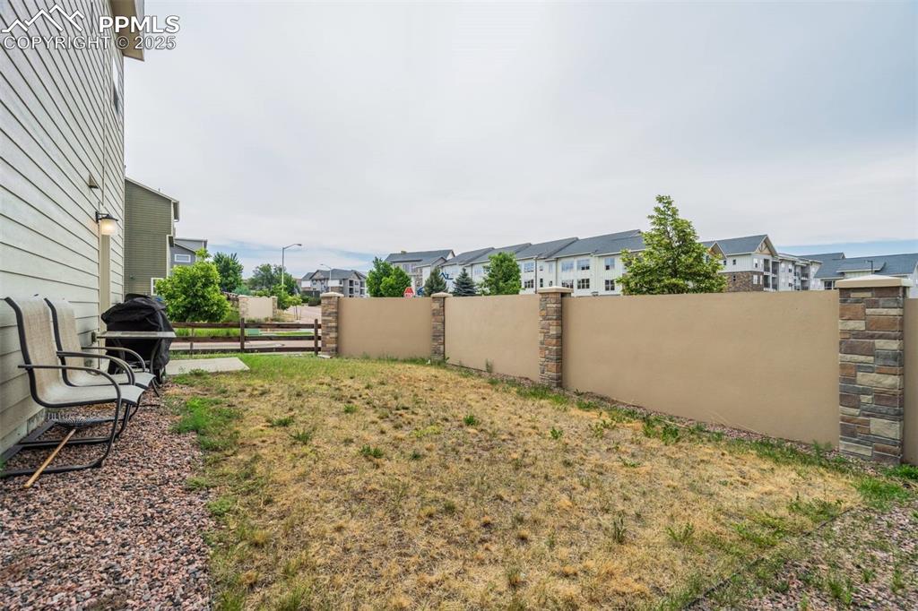 Image 27 of 27: View of yard featuring a residential view