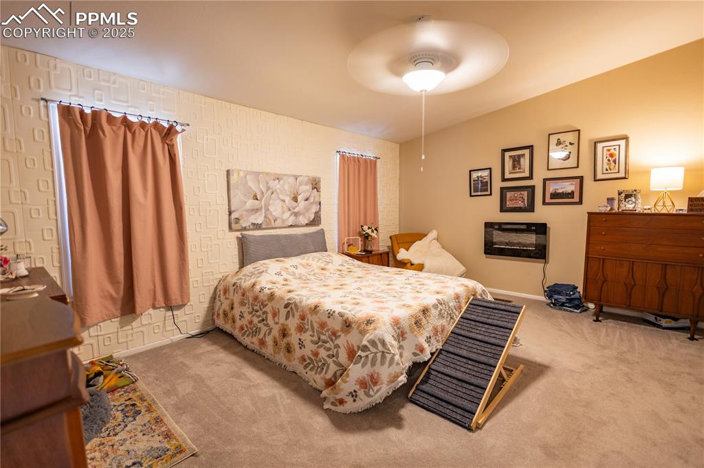 Image 13 of 19: Bedroom with carpet and a ceiling fan