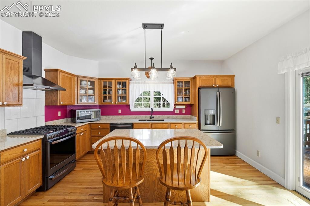 Image 12 of 47: Kitchen walks out to Back Deck