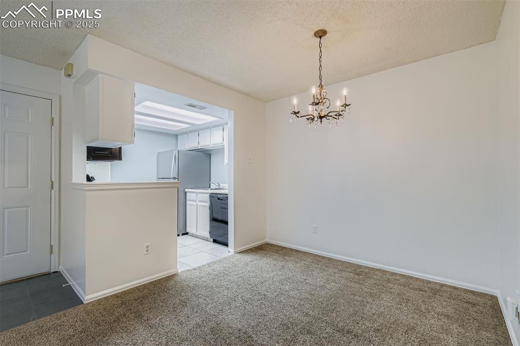 Image 7 of 23: Dining area looking at Kitchen