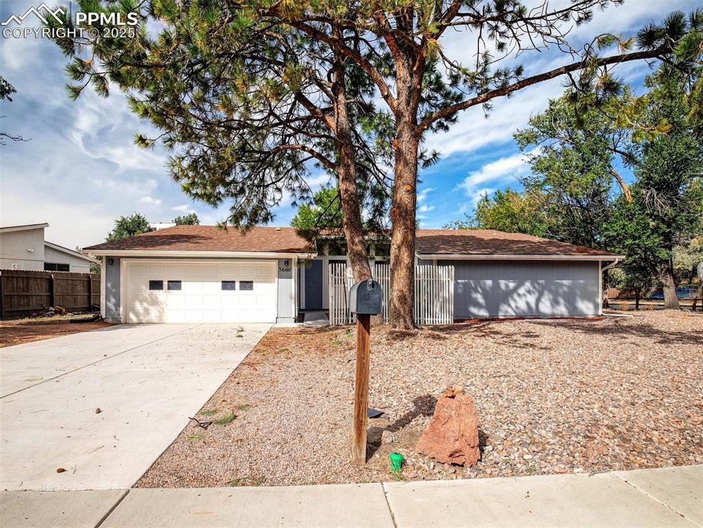 Caption: Ranch style home on a corner lot in the Homestead neighborhood of colorado Springs