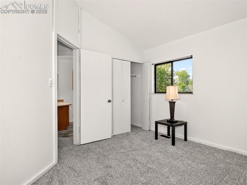 Image 20 of 44: Second main level bedroom.