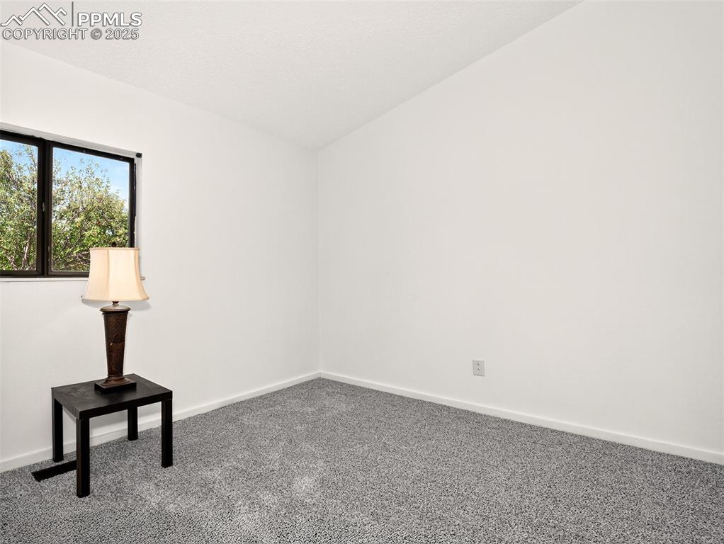 Image 21 of 44: Second main level bedroom.