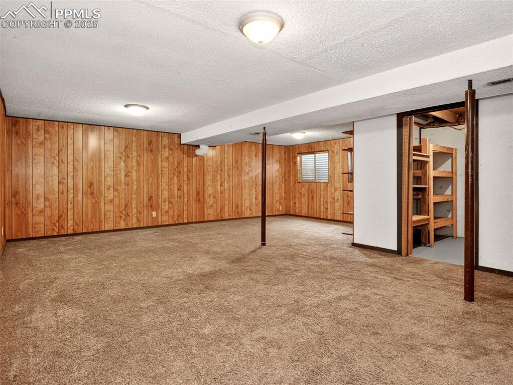 Image 27 of 44: Basement level family room / recreation space