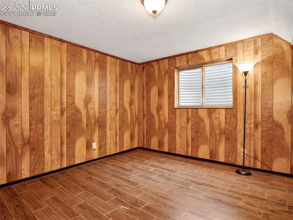 Image 31 of 44: Fourth basement level bedroom