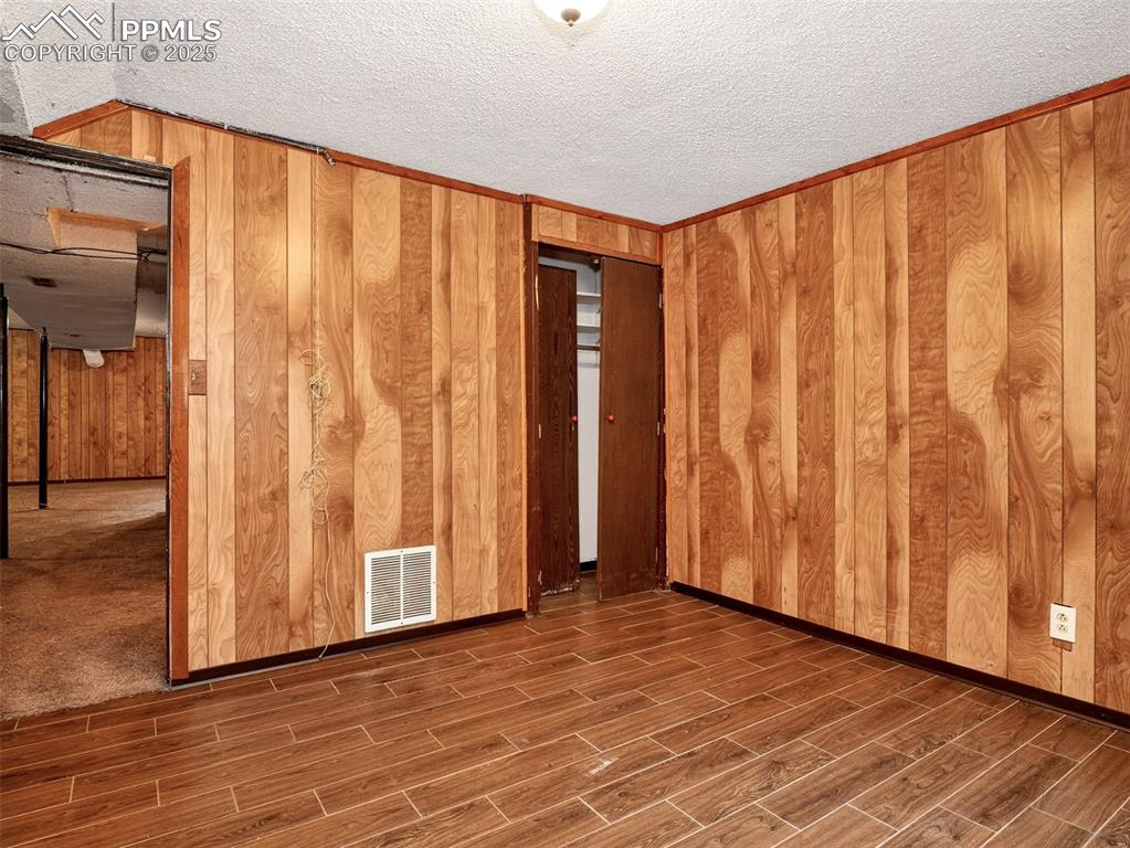Image 33 of 44: Fifth basement level bedroom