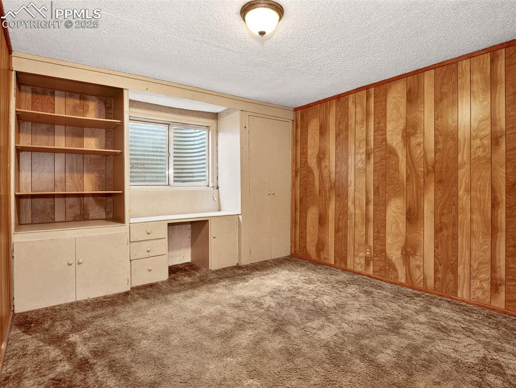 Image 34 of 44: Built-in shelving and cabinets