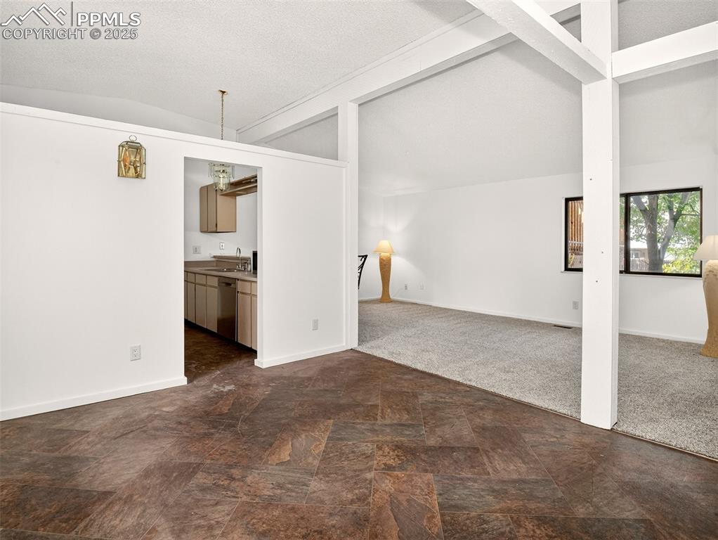 Image 5 of 44: Open layout with many windows fills the home with light