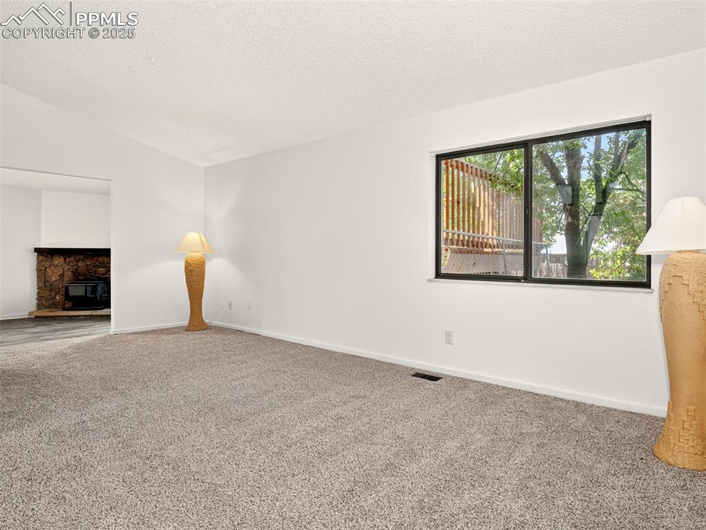 Image 7 of 44: Continue into the living room from the entry.