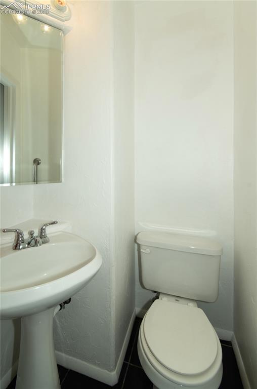 Image 16 of 30: 1/2 bath off the 3rd bedroom