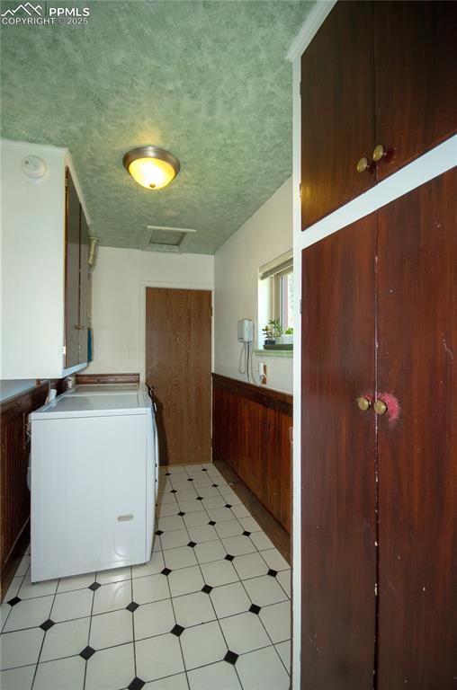 Image 21 of 30: Laundry area with ample storage