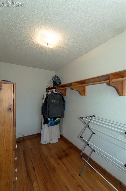 Image 9 of 30: Walkin closet off the Primary bedroom