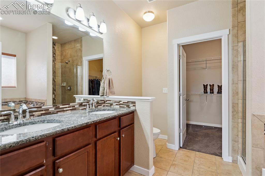 Image 13 of 28: The 5-piece en-suite bathroom features plenty of room for morning routines 