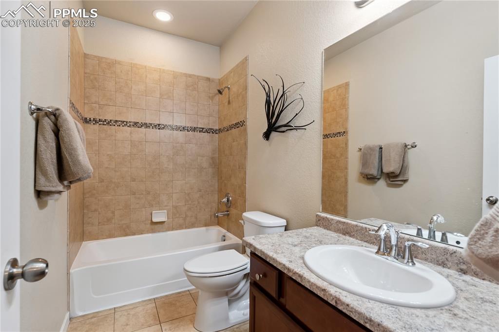 Image 16 of 28: Full bathroom #2 of 3 on the main floor has the same great stone counters a
