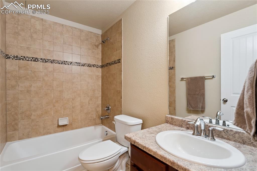 Image 23 of 28: The third full bathroom is in the basement and continues the quality of fin