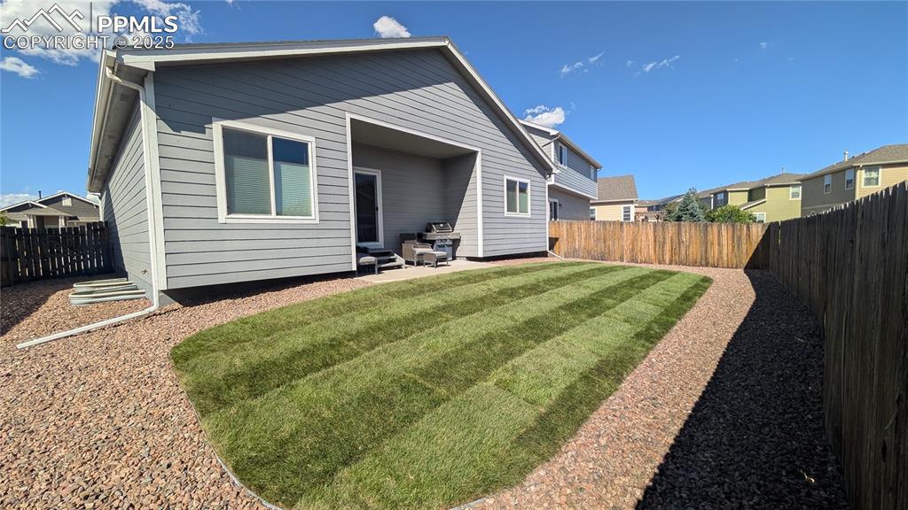 Image 26 of 28: Back yard with grass you could walk barefoot on
