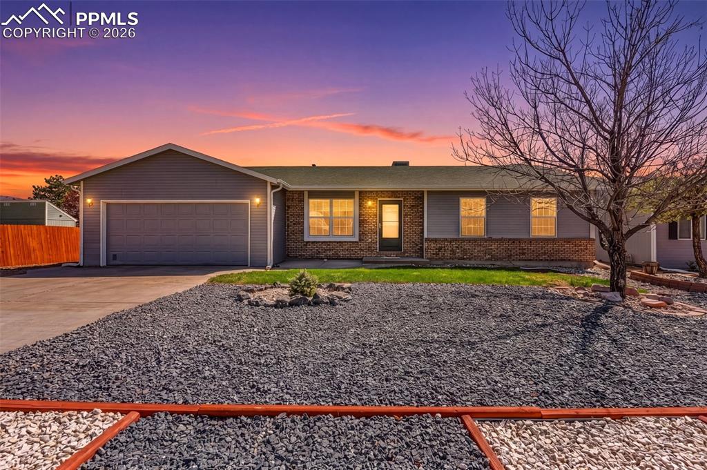 Image 1 of 27: Modern ranch with polished curb appeal, low-maintenance landscaping, and a 