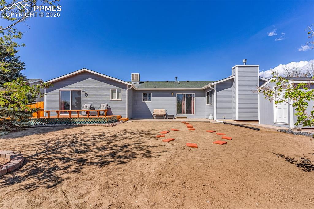 Image 21 of 27: Expansive, level backyard with full privacy fencing. A blank canvas ready f