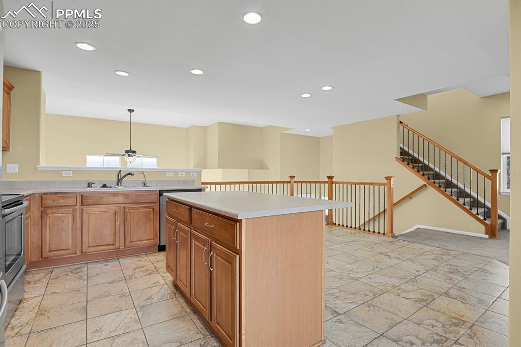 Image 23 of 45: Kitchen featuring recessed lighting, appliances with stainless steel finish