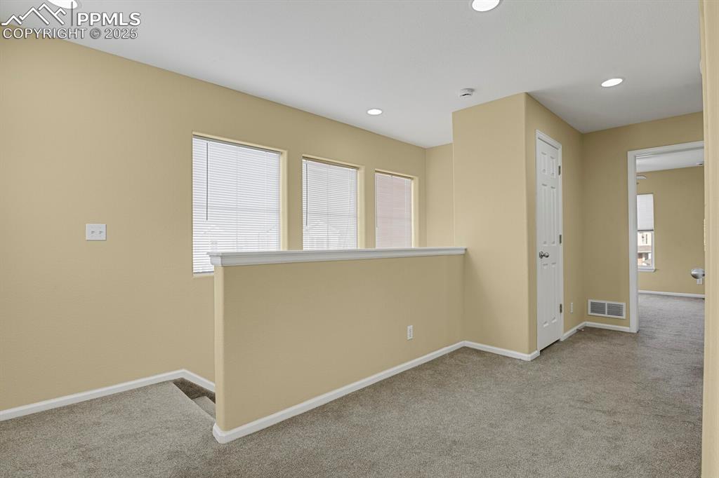 Image 28 of 45: Empty room featuring carpet and recessed lighting