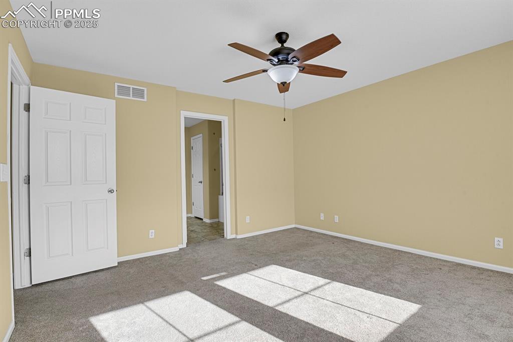 Image 30 of 45: Unfurnished bedroom featuring carpet floors and ceiling fan