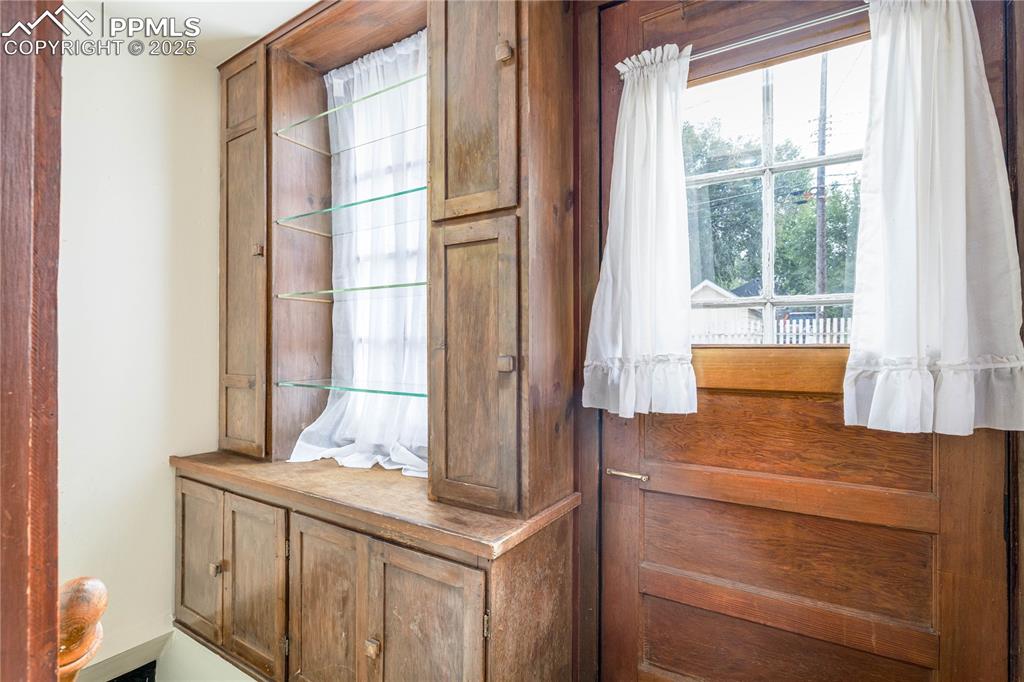 Image 14 of 33: walkout to backyard and stairway to basement