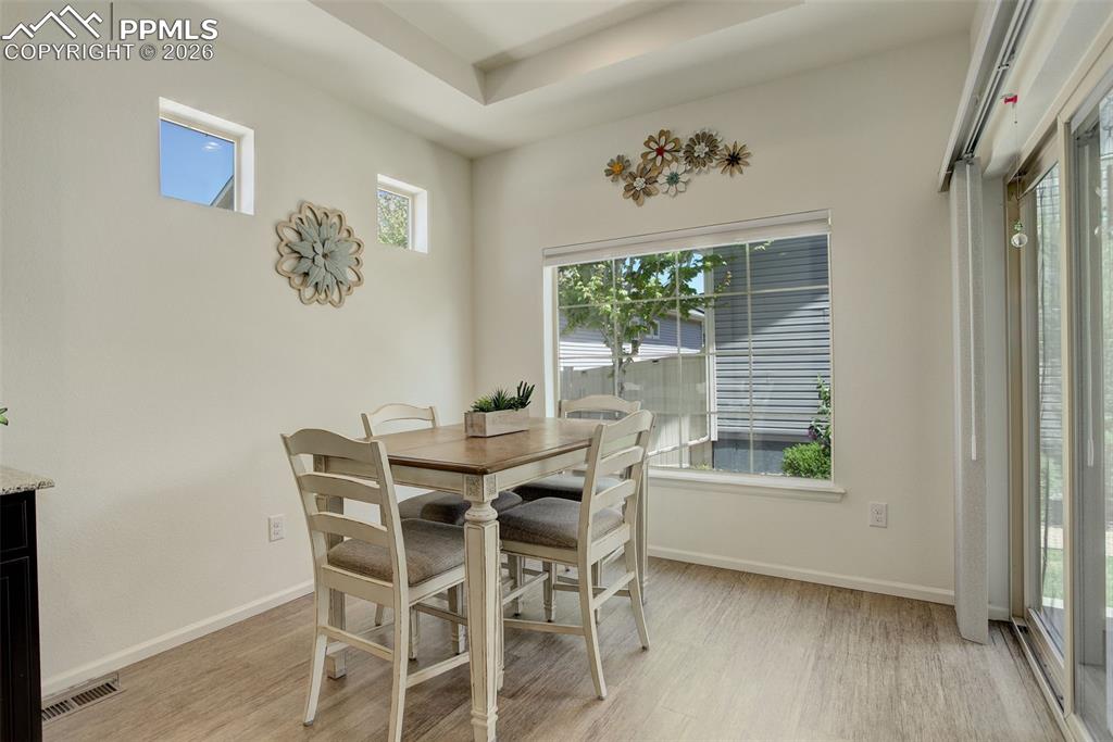 Image 14 of 29: Walk-out access to covered patio and yard