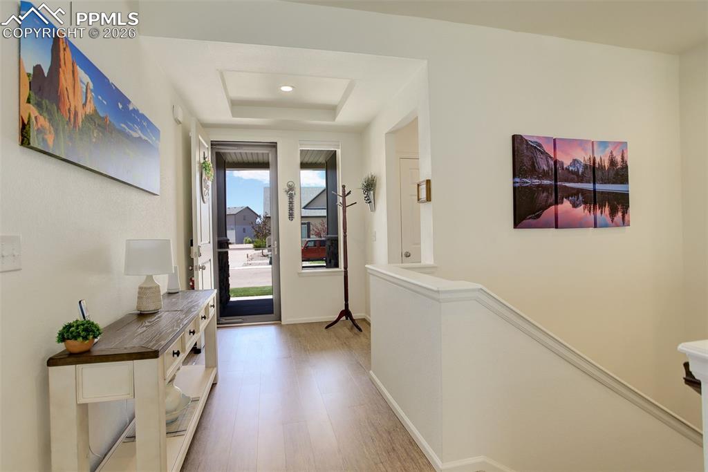 Image 6 of 29: Entry featuring LVP and open layout