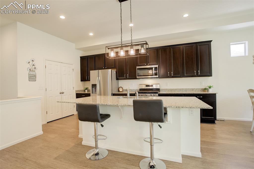 Image 7 of 29: Large island with granite countertops