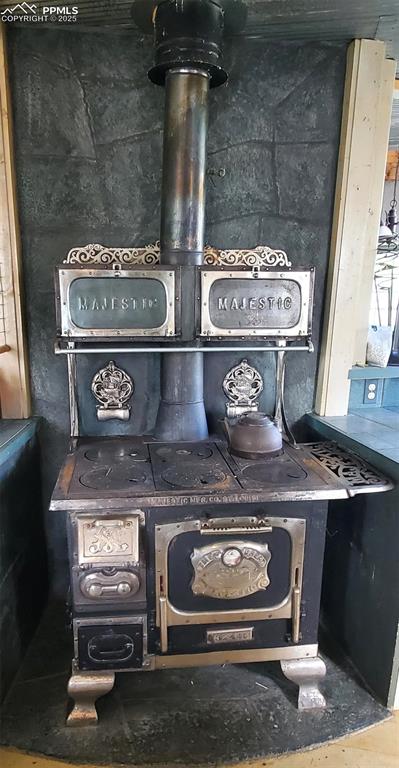 Image 11 of 14: Antique cooking/heating